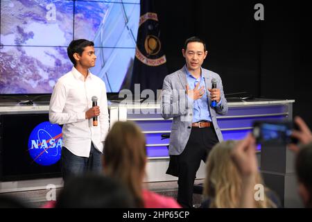 Arun Sharma, a graduate student at the Stanford Cardiovascular Institute in Stanford, California, left, Peter Lee, an assistant professor of surgery at Ohio State University, speak to social media participants in NASA's Kennedy Space Center Press Site auditorium ca. 2016 Stock Photo