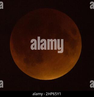 A perigee full moon, or supermoon, is seen during a total lunar eclipse on Sunday, September 27, 2015, in Washington, DC. The combination of a supermoon and total lunar eclipse last occurred in 1982 and will not happen again until 2033. Stock Photo