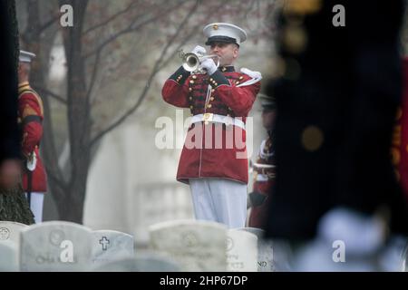 'Taps' is played during the funeral service for former astronaut and U.S. Senator John Glenn, who was buried with full military honors, at Arlington National Cemetery in Virginia on Thursday, April 6, 2017, the day on which he and his wife Annie were married in 1943. Stock Photo