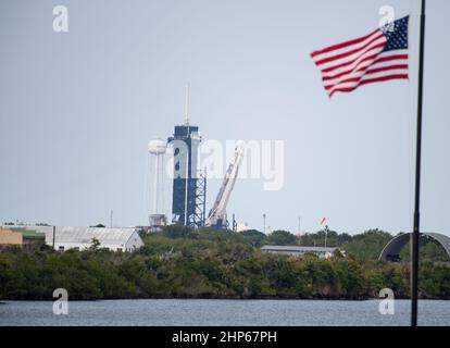 A SpaceX Falcon 9 rocket with the company's Crew Dragon spacecraft onboard is seen as it is raised into a vertical position on the launch pad at Launch Complex 39A as preparations continue for the Crew-2 mission, Friday, April 16, 2021, at NASA’s Kennedy Space Center in Florida. Stock Photo