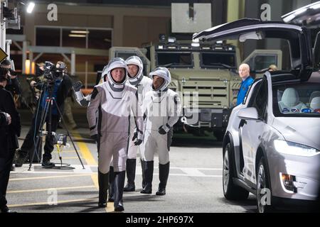 NASA astronauts Shane Kimbrough, front, Japan Aerospace Exploration Agency (JAXA) astronaut Akihiko Hoshide, second, and ESA (European Space Agency) astronaut Thomas Pesquet, back, wearing SpaceX spacesuits, are seen as they prepare to depart the Neil  A. Armstrong Operations and Checkout Building for Launch Complex 39A to board the SpaceX Crew Dragon spacecraft for the Crew-2 mission launch, Friday, April 23, 2021, at NASA’s Kennedy Space Center in Florida. Stock Photo