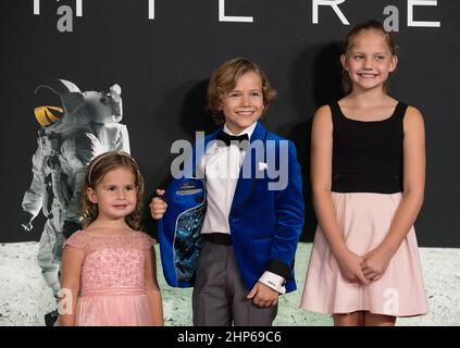 From left to right, American actress Lucy Brooke Stafford, American actor Gavin Warren, and American actress Claire Smith arrive on the red carpet for the premiere of the film 'First Man' at the Smithsonian National Air and Space Museum Thursday, Oct. 4, 2018 in Washington. The film is based on the book by Jim Hansen, and chronicles the life of NASA astronaut Neil Armstrong from test pilot to his historic Moon landing. Stock Photo