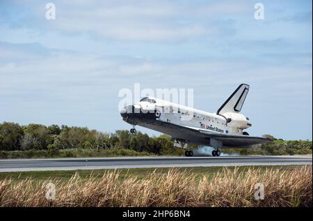Space shuttle Discovery touches down on Runway 15 at the Shuttle Landing Facility at NASA's Kennedy Space Center in Florida ca. 2011 Stock Photo