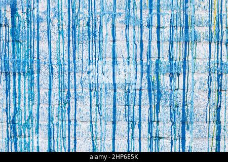 Blue paint drips on a white wall abstract grunge color background texture Stock Photo