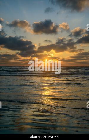 Ocean patterns with Sunrise over the ocean in Texas Stock Photo