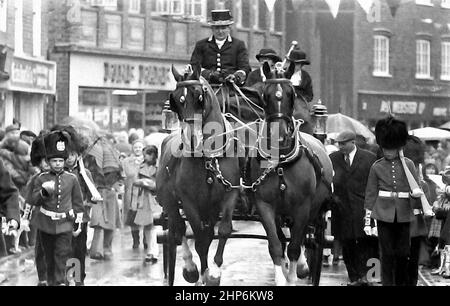 The annual Knutsford Royal May Day procession in 1976 in Knutsford, Cheshire, England, United Kingdom. It traditionally includes a fancy-dress pageant of children in historical or legendary costumes with  horse-drawn carriages. Stock Photo