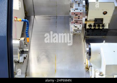Inside CNC lathe machine, machine tools for turning and cutting workpiece on smart factory, industrial 4.0 Stock Photo