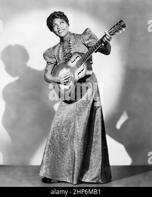 Publicity photo of American musician Sister Rosetta Tharpe posed with a guitar in 1938 Stock Photo