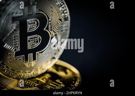 gold physical coin bitcoin on golden bitcoin Stock Photo