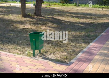 Iron urn in city park. Ecology concept. Stock Photo