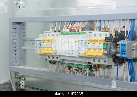 Programmable logic controller, automatic input of power reserve in the electrical cabinet. Close-up, selective focus. Stock Photo