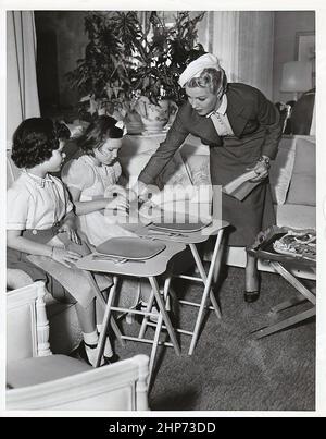 Lana Turner with daughter Cheryl Crane, and Melanie Bennett (daughter of Joan Bennett) on set of A Life of Her Own ca. 1950 Stock Photo