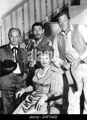 Main cast photo from the television program Gunsmoke in 1967.  Standing, from right: James Arness as Marshall Matt Dillon, Ken Curtis as Festus Hagen, and Milburn Stone as 'Doc' Adams. Seated: Amanda Blake as 'Miss Kitty' Russell Stock Photo