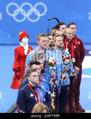 Beijing, China. 19th Feb, 2022. Medalists react during the awarding ceremony of curling men's event of Beijing 2022 Winter Olympics at National Aquatics Centre in Beijing, capital of China, Feb. 19, 2022. Credit: Wang Jingqiang/Xinhua/Alamy Live News Stock Photo