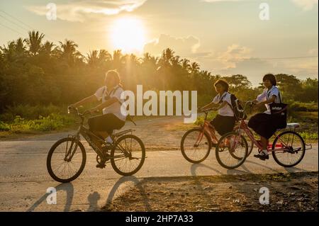 Schoolgirls in the countryside outside Hua Hin in Prachuap Khiri Khan Province of Thailand Stock Photo