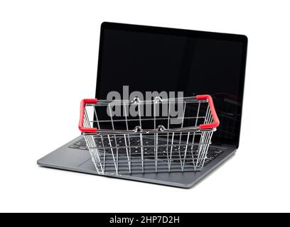 Laptop and shopping basket metal on white background. Internet shopping concept Stock Photo