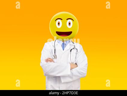 Emoji head man doctor standing with his arms folded and smiling at the camera isolated white background.Emoji concept. Stock Photo