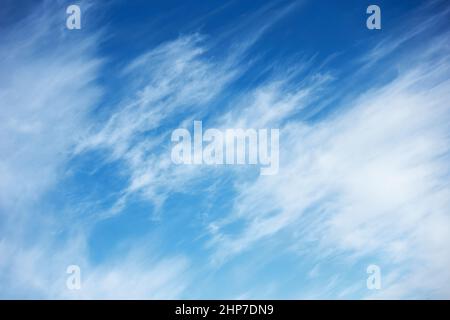 Abstract background with fast moving clouds in the blue sky Stock Photo
