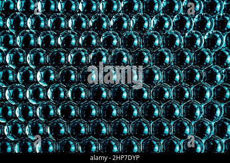 Black geometric abstract background of gel balls. Macro of dark blue hydrogel polymer. Top view Stock Photo