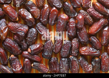 close up of fresh date fruits on table  Stock Photo