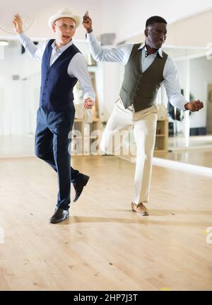 Two professional dancers practicing lindy hop in dance class Stock Photo