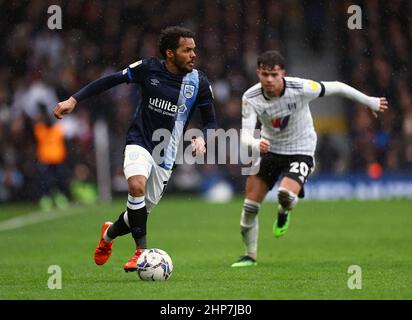 Huddersfield Town's Duane Holmes gets away from Fulham's Neco Williams (right) during the Sky Bet Championship match at Craven Cottage, London. Picture date: Saturday February 19, 2022. Stock Photo