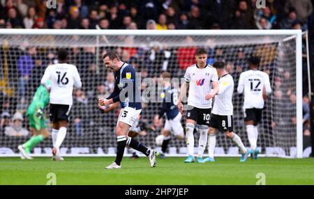 Huddersfield Town's Harry Toffolo reacts after team mate Duane Holmes scored the second goal of the game during the Sky Bet Championship match at Craven Cottage, London. Picture date: Saturday February 19, 2022. Stock Photo