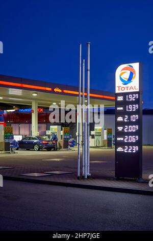 Denkendorf, Germany - February 19, 2022: Price display in front of a gas station at night. High and expensive fuel prices in europe. Total. Stock Photo