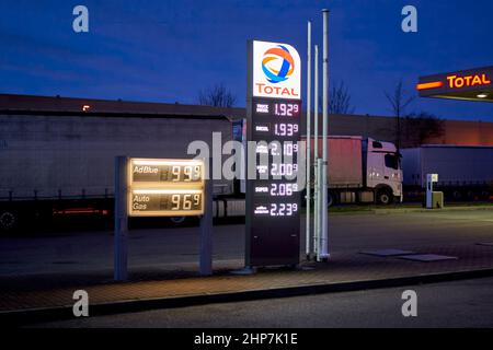 Denkendorf, Germany - February 19, 2022: Price display in front of a gas station at night. High and expensive fuel prices in europe. Total. Stock Photo