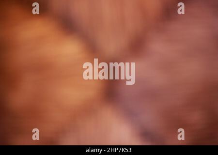 Dreamy blurry view of a wicker chair seat with a basket weave pattern. Stock Photo