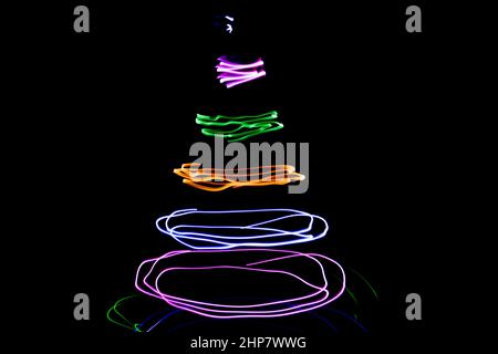 Multicolored circular lights on a black background Stock Photo