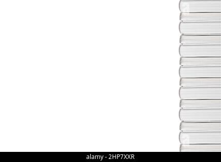 Banner with hardback books tower isolated on white background. Vertical books border with copyspace. Education and reading leisure concept. High quality photo Stock Photo