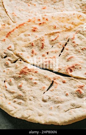 Carta Da Musica, an Italian flabread eaten with cheese and cured meat, also called pane carasau in Sardinia where it is a specialty. Stock Photo