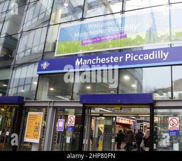 Manchester, UK, 19th February, 2022.  People enter Piccadilly Station, Manchester, UK. Trains are cancelled and delayed from Manchester, England, United Kingdom, British Isles in the wake of Storm Eunice. There are no trains from Manchester to Preston where storm Eunice damaged the roof of the station. Network Rail staff are checking train lines for fallen trees and damage. Public transport across Europe has been affected by the storm. Credit: Terry Waller/Alamy Live News Stock Photo