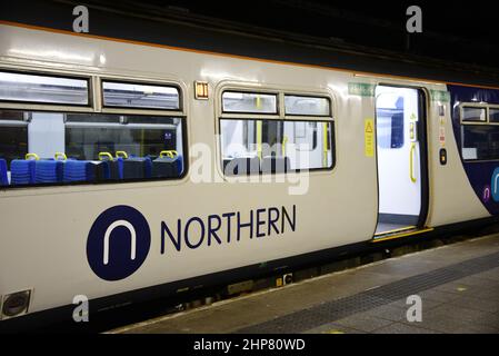 Manchester, UK, 19th February, 2022. A Northern line train at Victoria Station, Manchester, UK.  Trains are cancelled and delayed from Manchester, England, United Kingdom, British Isles in the wake of Storm Eunice. There are no trains from Manchester to Preston where storm Eunice damaged the roof of the station. Network Rail staff are checking train lines for fallen trees and damage. Public transport across Europe has been affected by the storm. Credit: Terry Waller/Alamy Live News Stock Photo