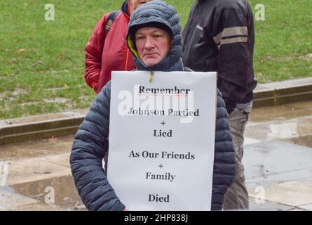 London, UK. 19th February 2022. A protester in Parliament Square. Demonstrators gathered in Westminster in protest against Boris Johnson, as pressure on the UK Prime Minister continues. Credit: Vuk Valcic/Alamy Live News Stock Photo