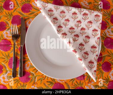 Still life of plate with knife, fork and napkin Stock Photo