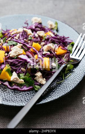 Home made red cabbage mango salad with vegan feta