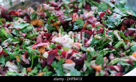 Close up of fresh and raw vegetable chop, with coriander leaves, pak choy, carrot and beetroot. Stock Photo