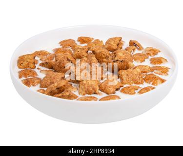 Crispy pads chocolate pillows with milk in dish isolated on the white background Stock Photo