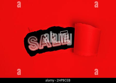 Red torn paper whole with sale text promo Stock Photo