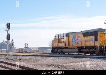 Taylor, Tx - Union Pacific Railroad diesel locomotive waiting for other trains to pass on main rail line. Stock Photo