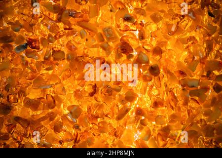 Amber wall mosaic, closeup background photo with selective soft focus Stock Photo