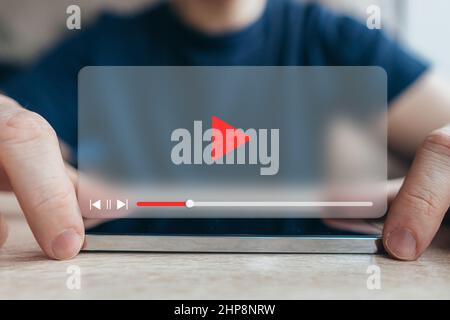 Video player interface concept. The person is using a smartphone Stock Photo