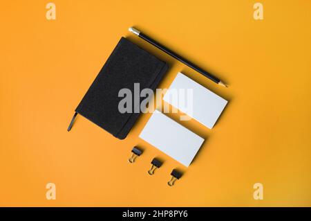 Blank corporate stationery set on yellow background. Template for branding design. Top view. Flat lay. Stock Photo