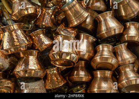 Copper bazaar in Turkey. Traditional and handmade coppers. Coffee pots, tea pots, souvenirs, pans, gifts. Stock Photo