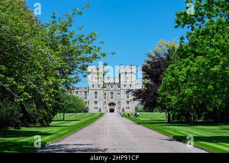 The George IV gateway to the Upper Ward of Windsor Castle seen from the Long Walk. Trees and grass line the side of the road. Windsor, Berkshire, UK Stock Photo