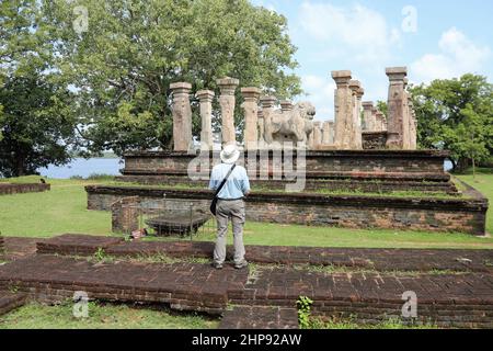 Historian at the Council Chamber of King Nissanka Malla in the ancient city of Polonnaruwa Stock Photo