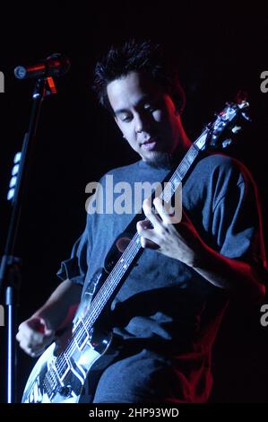 Milan Italy 2002-02-23 : Live concert by the American band Linkin Park at the Alcatraz nightclub,the singer and guitarist Mike Shinoda during the concert Stock Photo