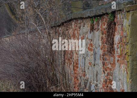 Old wall of town park in Telc in winter cold dark morning Stock Photo